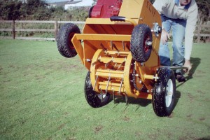 A motorised lawn aerator for grass aeration