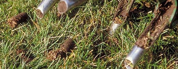 Lawn Aeration in progress - a close-up of a Lawn Aerator at work