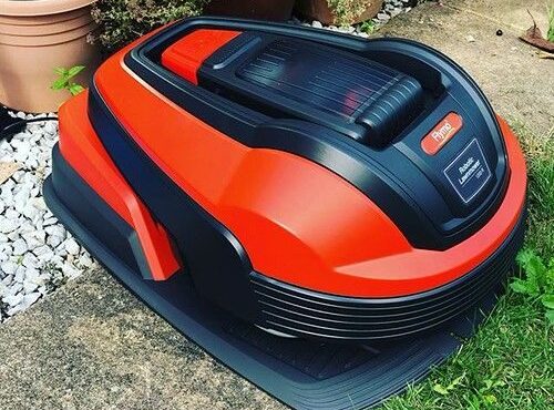 Flymo robotic lawn mower on a garden lawn