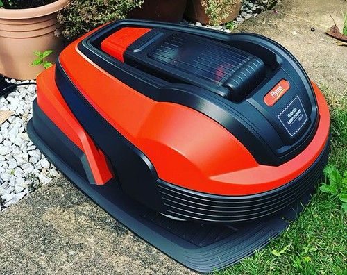 Flymo robotic lawn mower on a garden lawn